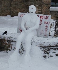 Snowman with can on a wall